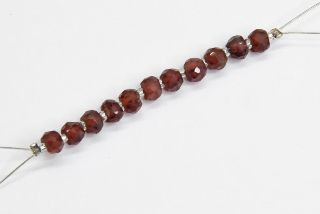 NATURAL GARNET BEADS FACETED RONDELLE 4 MM 11 PCS (4 TASSELS): These are natural, earth mined and hand crafted with precision. Stone: Garnet, Stone Shape: Faceted Rondelle, Stone Size: 4 mm, Width: 2.5 - 3 mm, Weight: approx. 7 carats. The photographs are general