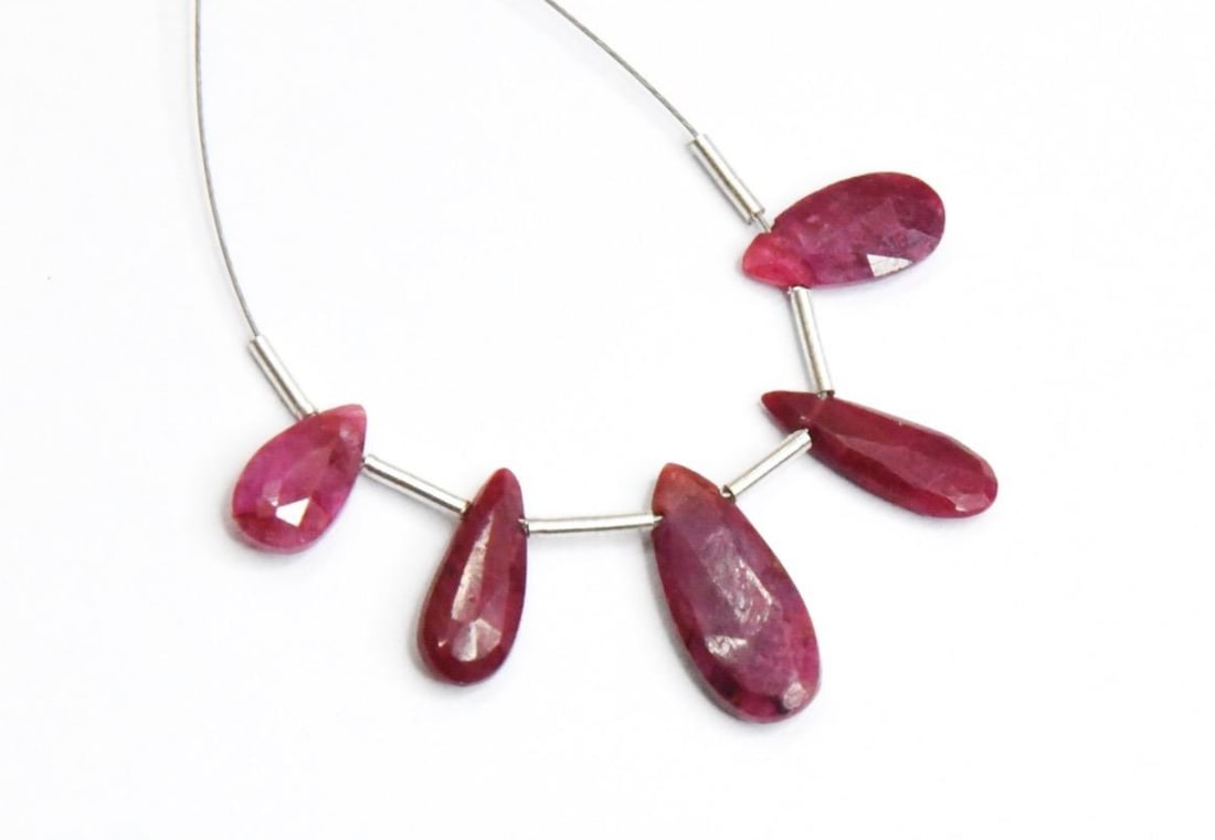 NATURAL RUBY (DYED) BEADS FACETED PEAR 5X9 - 6X14 MM 5 PCS: These are natural, earth mined and hand crafted with precision. Stone: Ruby (Dyed), Stone Shape: Faceted Pear, Stone Size: 5x9 - 6x14 mm, Width: 2 - 2.5 mm, Weight: approx 8 carats. The photographs ar