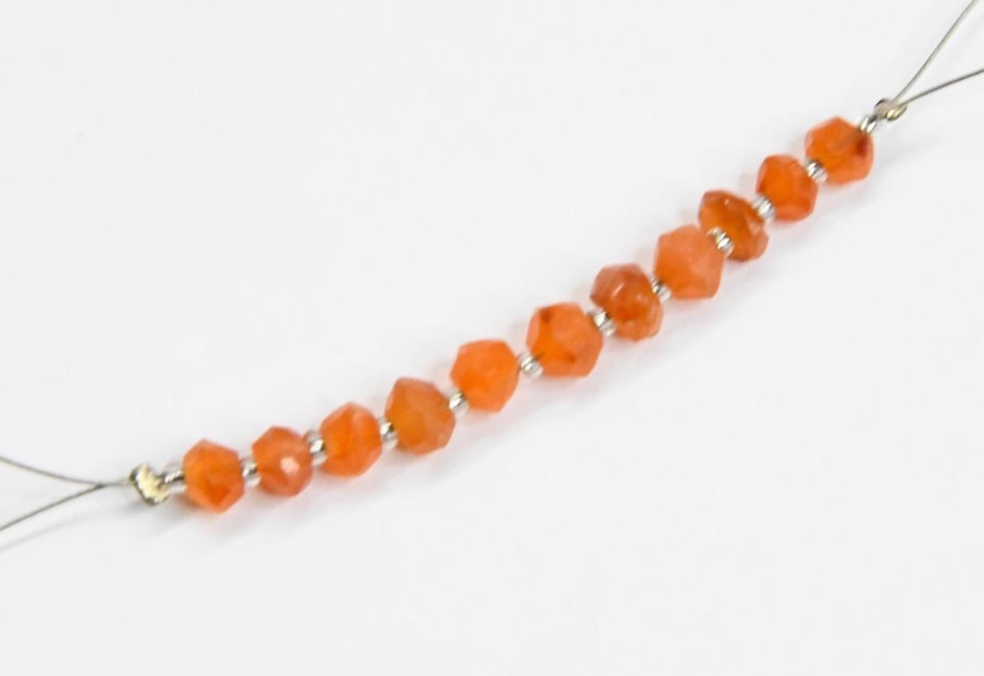 NATURAL CARNELIAN BEADS FACETED RONDELLE 4 - 4.5 MM, 11 PCS (3 TASSELS): These are natural, earth mined and hand crafted with precision. Stone: Carnelian, Stone Shape: Faceted Rondelle, Stone Size: 4 - 4.5 mm, Width: 2 - 3 mm, Weight: approx. 4.5 carats. The photographs ar