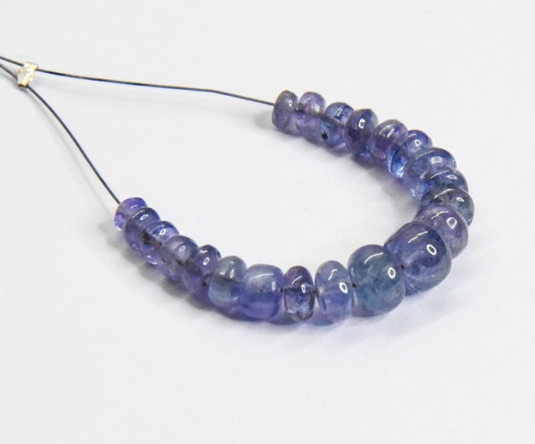 NATURAL TANZANITE BEADS RONDELLE 3.5 - 6 MM, 21 PCS: These are natural, earth mined and hand crafted with precision. Stone: Tanzanite, Stone Shape: Rondelle, Stone Size: 3.5 - 6 mm, Width: 1.5 - 4 mm, Weight: approx. 15 carats. The photographs are gener