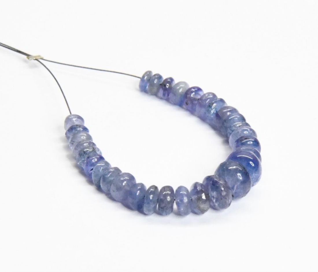 NATURAL TANZANITE BEADS RONDELLE 3.5 - 7 MM, 30 PCS: These are natural, earth mined and hand crafted with precision. Stone: Tanzanite, Stone Shape: Rondelle, Stone Size: 3.5 - 7 mm, Width: 2 - 4 mm, Weight: approx. 19 carats. The photographs are general