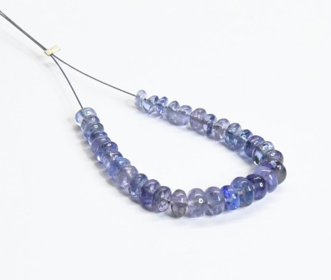 NATURAL TANZANITE BEADS RONDELLE 3 - 5 MM, 33 PCS: These are natural, earth mined and hand crafted with precision. Stone: Tanzanite, Stone Shape: Rondelle, Stone Size: 3 - 5 mm, Width: 1.5 - 3 mm, Weight: approx. 15 carats. The photographs are general
