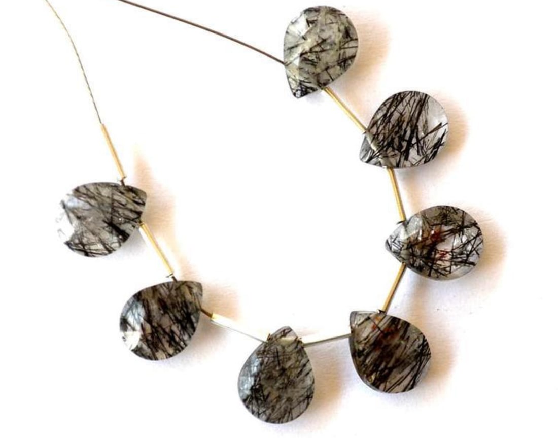 NATURAL BLACK RUTILE BEADS FACETED PEAR 6X8 - 7X9 MM 7 PCS (3 TASSELS): These are natural, earth mined and hand crafted with precision. Stone: Black Rutile, Stone Shape: Faceted Pear, Stone Size: 6.5x8.5 - 7x9 mm, Width: 3 - 4 mm, Weight: approx. 11.2 carats. The photogra