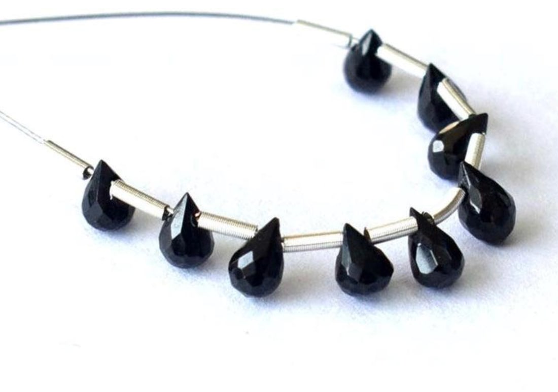 NATURAL BLACK SPINEL BEADS FACETED BRIOLETTE 2X4 - 3X5 MM 9 PCS (3 TASSELS): These are natural, earth mined and hand crafted with precision. Stone: Black Spinel, Stone Shape: Faceted Briolette, Stone Size: 2.5x4 - 3x5 mm, Weight: approx. 3.75 carats. The photographs are genera