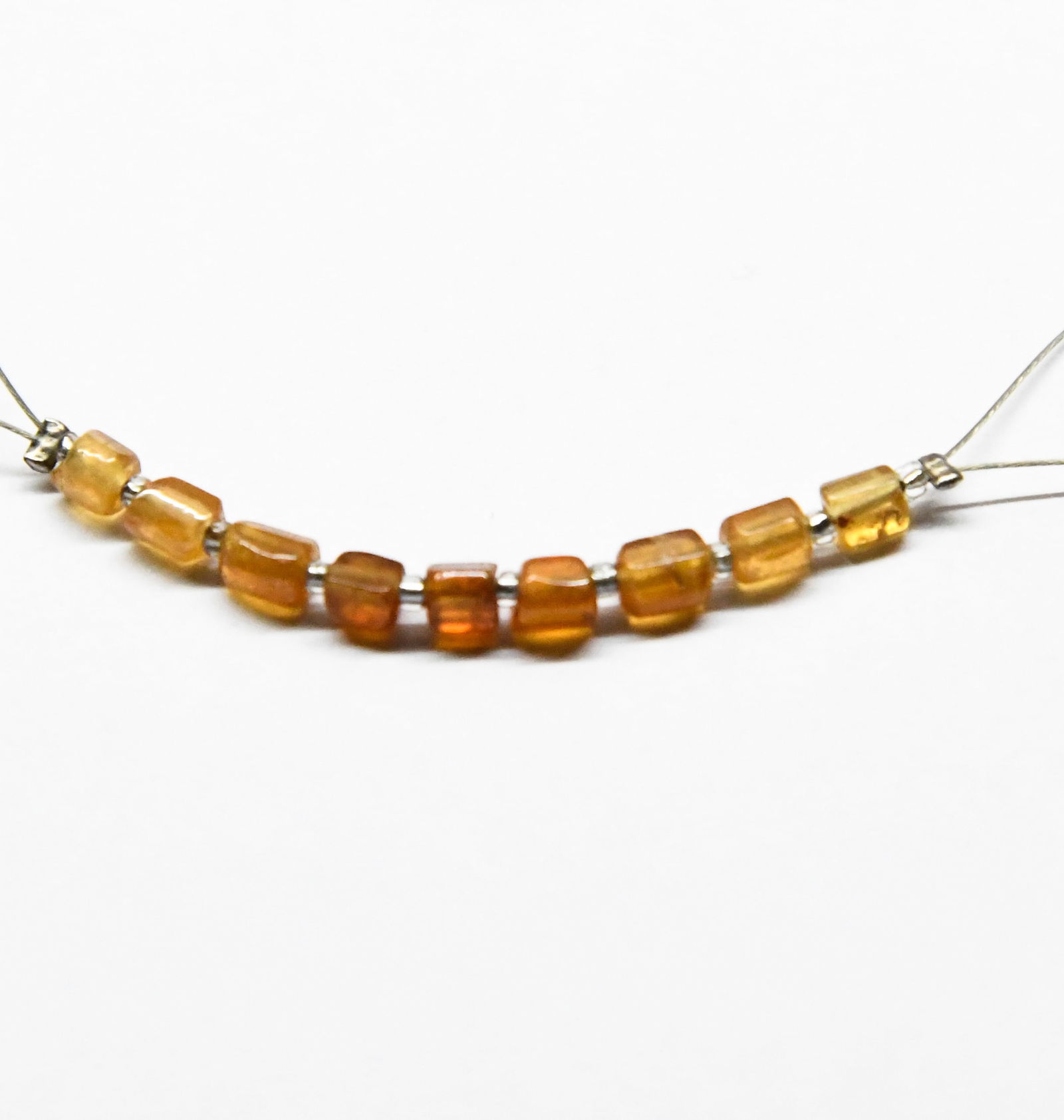 NATURAL HESSONITE GARNET BEADS TUBE 2X3 - 3X4 MM 9 PCS (2 TASSELS): These are natural, earth mined and hand crafted with precision. Stone: Hessonite Garnet, Stone Shape: Tube, Stone Size: 2x3 - 3x4 mm, Weight: approx. 4.46 carats. The photographs are generally enlarge