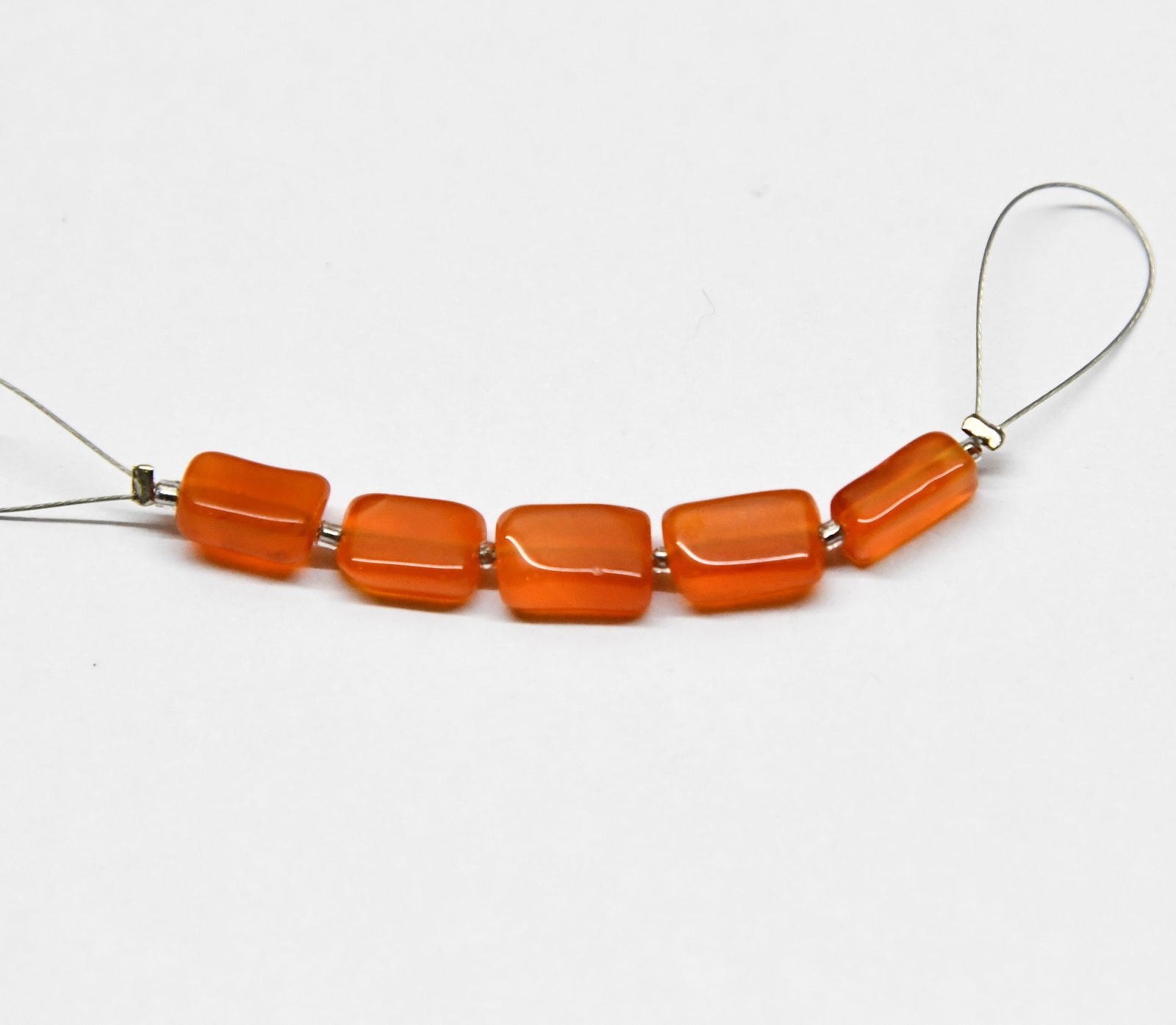 NATURAL CARNELIAN BEADS CUBE 5X7 - 6X10 MM, 5 PCS (3 TASSELS): These are natural, earth mined and hand crafted with precision. Stone: Carnelian, Stone Shape: Cube, Stone Size: 5.5x7 - 6.5x10 mm, Width: 3.5 - 4.5 mm, Weight: approx. 9.25 carats. The photographs ar
