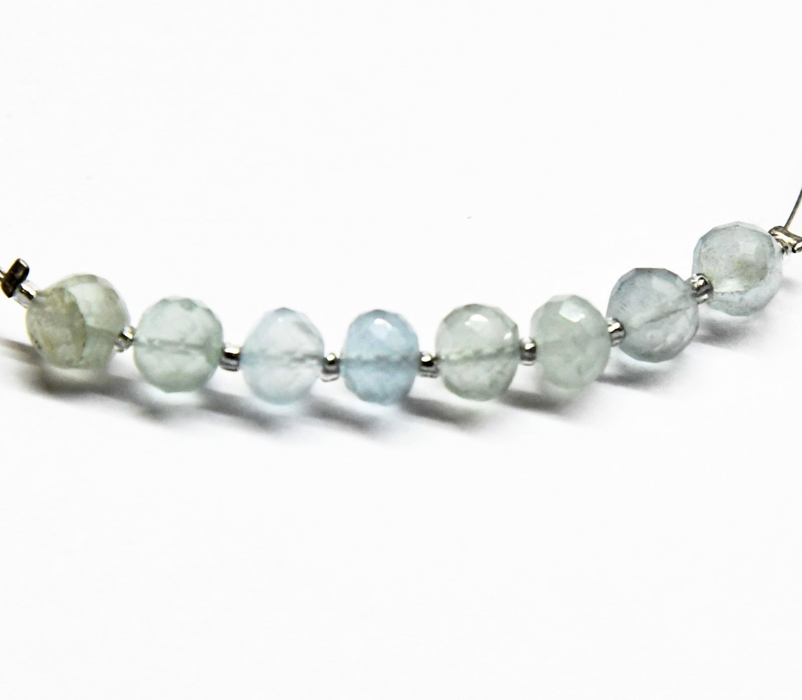 NATURAL AQUAMARINE BEADS FACETED RONDELLE 5.5 - 6 MM 8 PCS (2 TASSELS): These are natural, earth mined and hand crafted with precision. Stone: Aquamarine, Stone Shape: Faceted Rondelle, Stone Size: 5.5 - 6 mm, Width: 4.5 - 5 mm, Weight: approx. 10.42 carats. The photograp