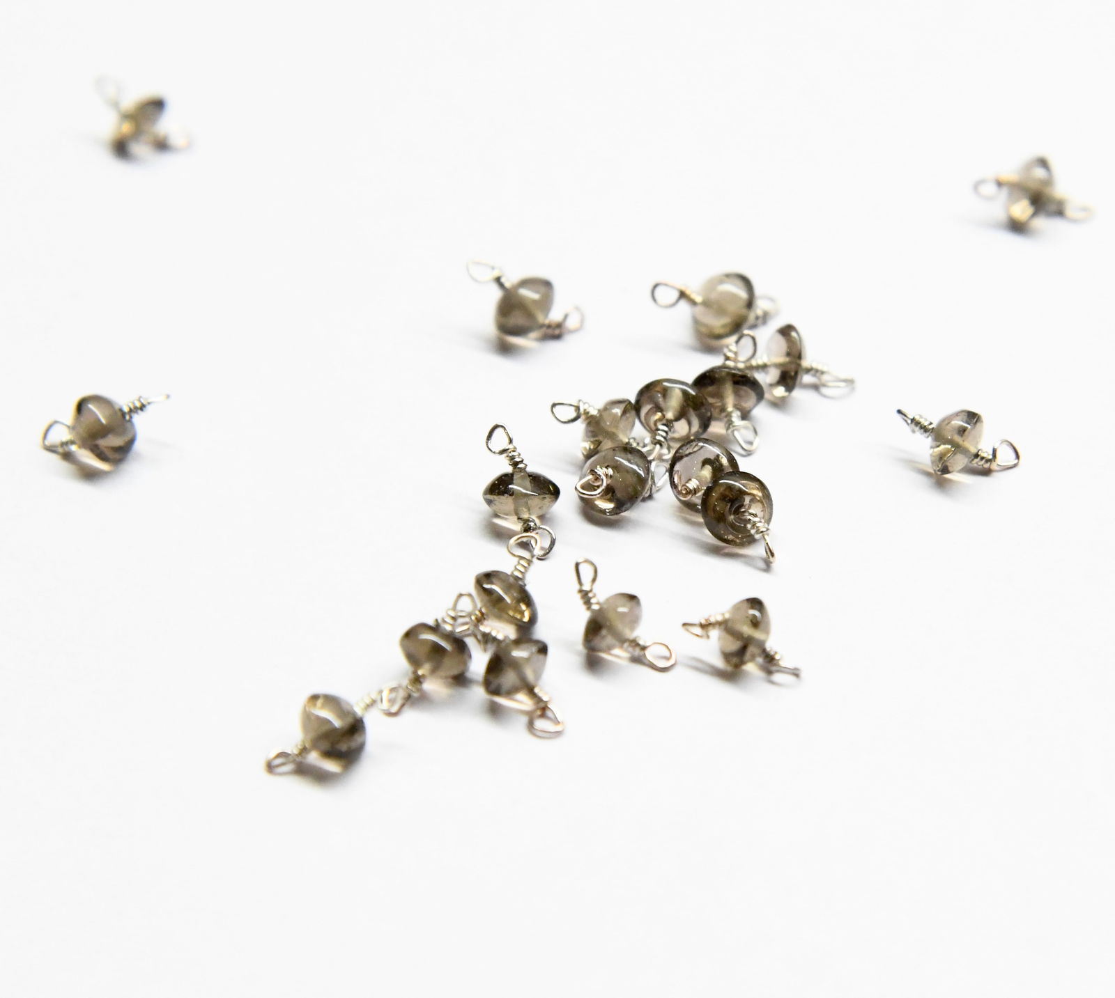 NATURAL SMOKY QUARTZ BEADS RONDELLE 4.5 MM 20 PCS: These are natural, earth mined and hand crafted with precision. Stone: Smoky Quartz, Stone Shape: Rondelle, Stone Size: 4.5 mm, Width: 2 - 3 mm, Weight: approx. 12.60 carats. The photographs are gener