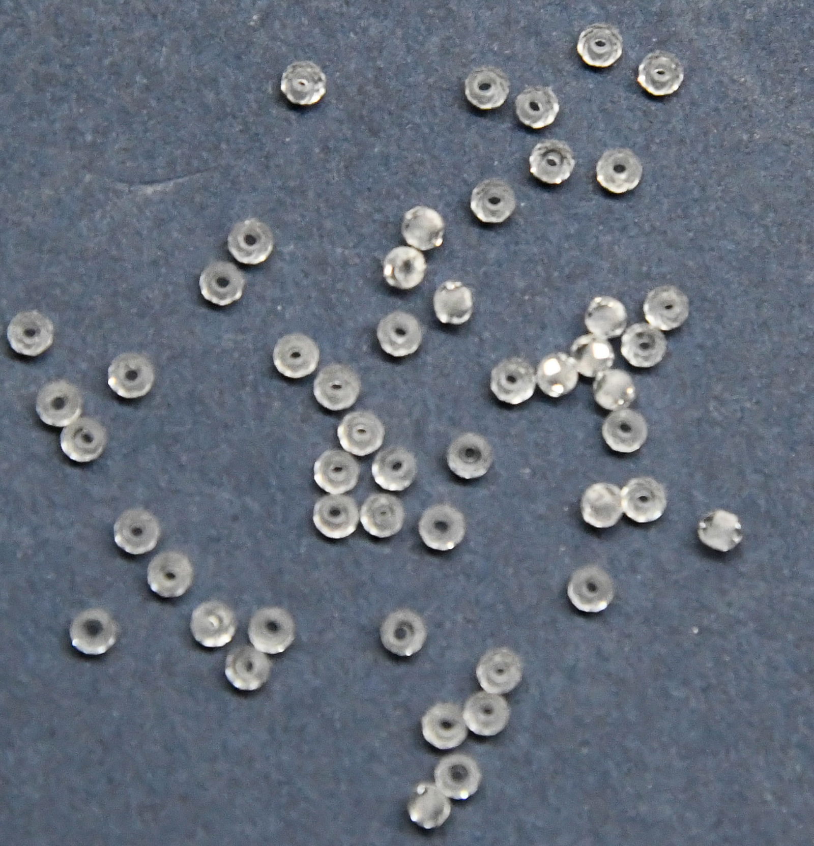 NATURAL WHITE TOPAZ BEADS ROUND 1.5 MM 50 PCS (6 BAGS): These are natural, earth mined and hand crafted with precision. Stone: White Topaz, Stone Shape: Faceted Round, Stone Size: 1.5 mm, Weight: approx. 1.62 carats. The photographs are generally enlarged