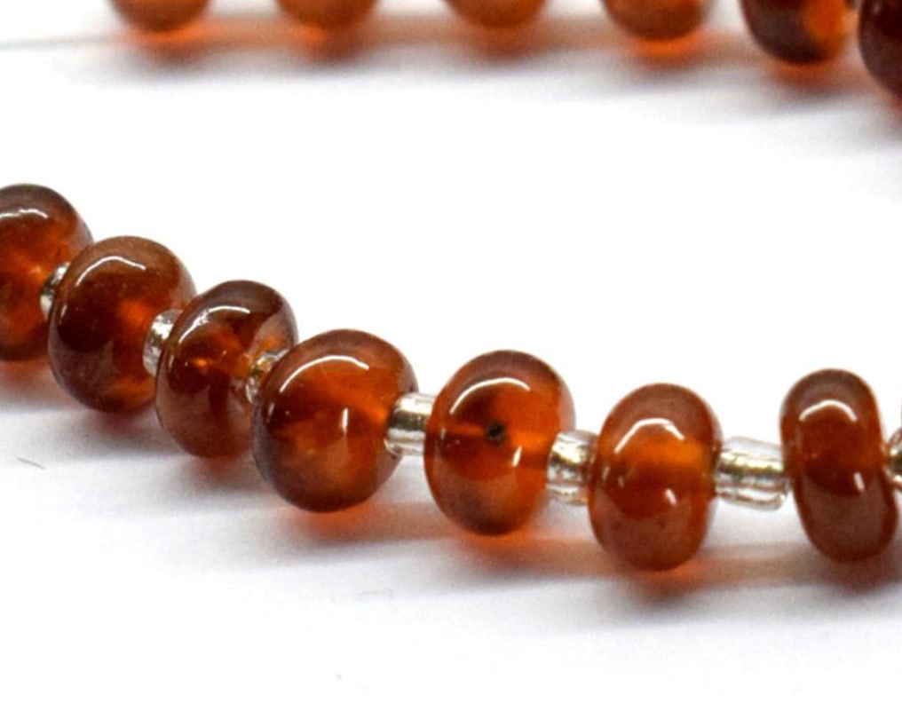 NATURAL GARNET BEADS RONDELLE 5.5 - 6.5 MM 9 PCS: These are natural, earth mined and hand crafted with precision. Stone: Garnet, Stone Shape: Rondelle, Stone Size: 5.5 - 6.5 mm, Width: 3 - 4 mm, Weight: approx. 14 carats. The photographs are generall