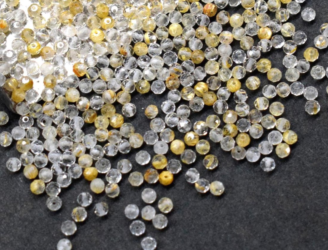 NATURAL GOLDEN RUTILE BEADS FACETED ROUND 2 MM - 50 PCS (5 BAGS): These are natural, earth mined and hand crafted with precision. Stone: Golden Rutile, Stone Shape: Faceted Round, Stone Size: 2 mm, Weight: approx. 3.80 carats. The photographs are generally enlarged
