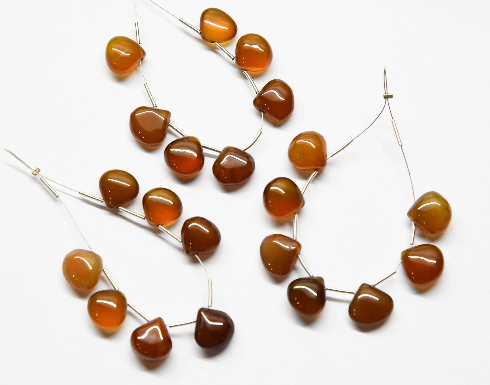 NATURAL BROWN CHALCEDONY BEADS HEART 10 - 11 MM - 7 PCS (4 TASSELS): These are natural, earth mined and hand crafted with precision. Stone: Brown Chalcedony, Stone Shape: Heart, Stone Size: 10 - 11 mm, Width: 5 - 6 mm, Weight: approx. 36 carats. The photographs are gen