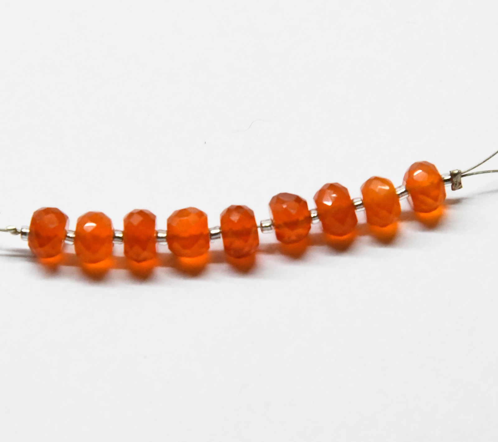 NATURAL CARNELIAN BEADS FACETED RONDELLE 5.5 - 6 MM, 9 PCS: These are natural, earth mined and hand crafted with precision. Stone: Carnelian, Stone Shape: Faceted Rondelle, Stone Size: 5.5 - 6 mm, Width: 3 - 4 mm, Weight: approx. 10 carats. The photographs are