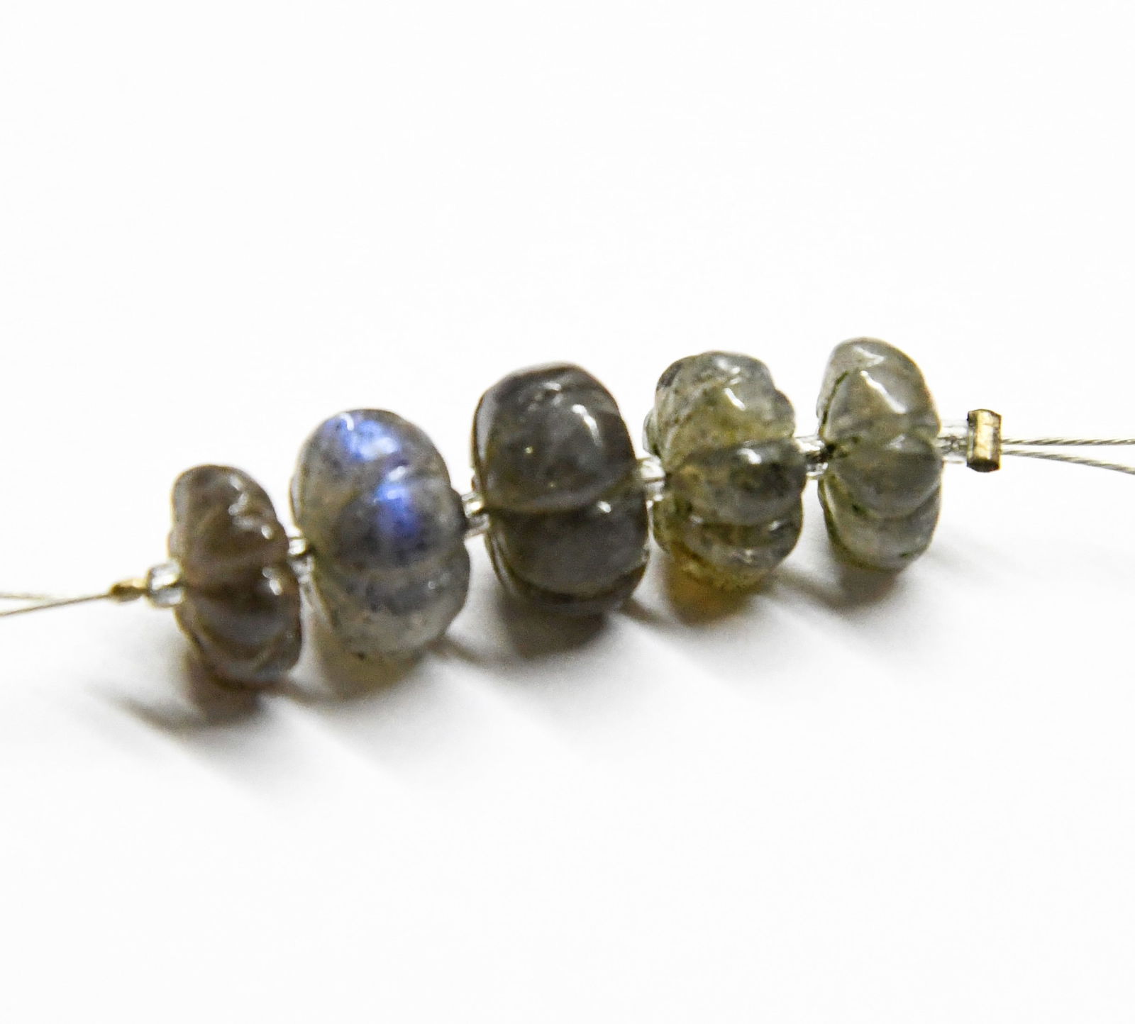 NATURAL LABRADORITE BEADS CARVED RONDELLE 8 - 9.5 MM, 5 PCS: These are natural, earth mined and hand crafted with precision. Stone: Labradorite, Stone Shape: Carved Rondelle, Stone Size: 8 - 9.5 mm, Width: 3.5 - 5mm, Weight: approx. 13 carats. The photographs a