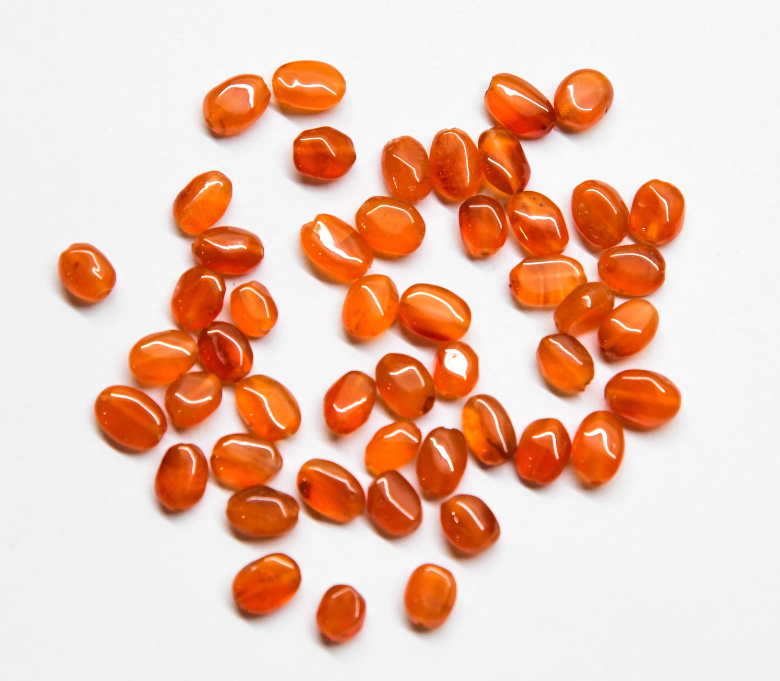 NATURAL CARNELIAN BEADS OVAL 5X6 - 5.5X9 MM - 50 PCS: These are natural, earth mined and hand crafted with precision. Stone: Carnelian, Stone Shape: Oval, Stone Size: 5x6 - 5.5x9 mm, Width: 3 - 4 mm, Weight: approx. 60 carats. The photographs are general