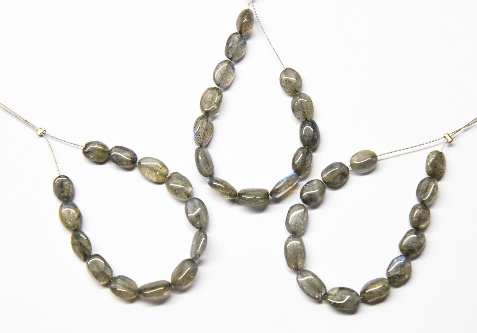 NATURAL LABRADORITE BEADS OVAL 5X6 - 5X8 MM 13 PCS - (4 TASSELS): These are natural, earth mined and hand crafted with precision. Stone: Labradorite, Stone Shape: Oval, Stone Size: 5x6.5 - 5x8 mm, Width: 2.5 - 4 mm, Weight: approx. 13 carats. The photographs are gen