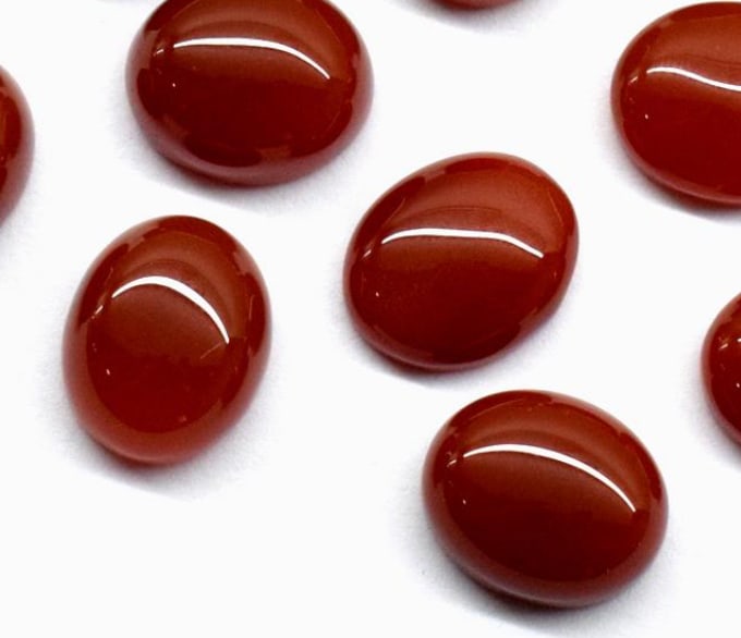 NATURAL RED ONYX CABOCHONS OVAL 9X11 MM - 2 PCS: These are natural, earth mined and hand crafted with precision. Stone: Red Onyx, Stone Shape: Cabochon Oval, Stone Size: 9x11mm, Width: 5 mm, Weight: approx. 7.50 carats. The photographs are generally