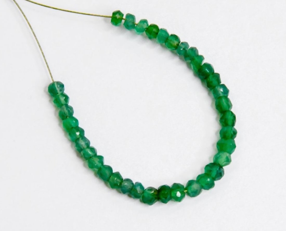 NATURAL GREEN ONYX BEADS FACETED RONDELLE 35 PCS, 3 - 4.5 MM - (2 TASSELS): These are natural, earth mined and hand crafted with precision. Stone: Green Onyx, Stone Shape: Faceted Rondelle, Stone Size: 3 - 4.5 mm, Width: 1.5 - 2.5 mm, Weight: approx. 5.50 carats. The photogra