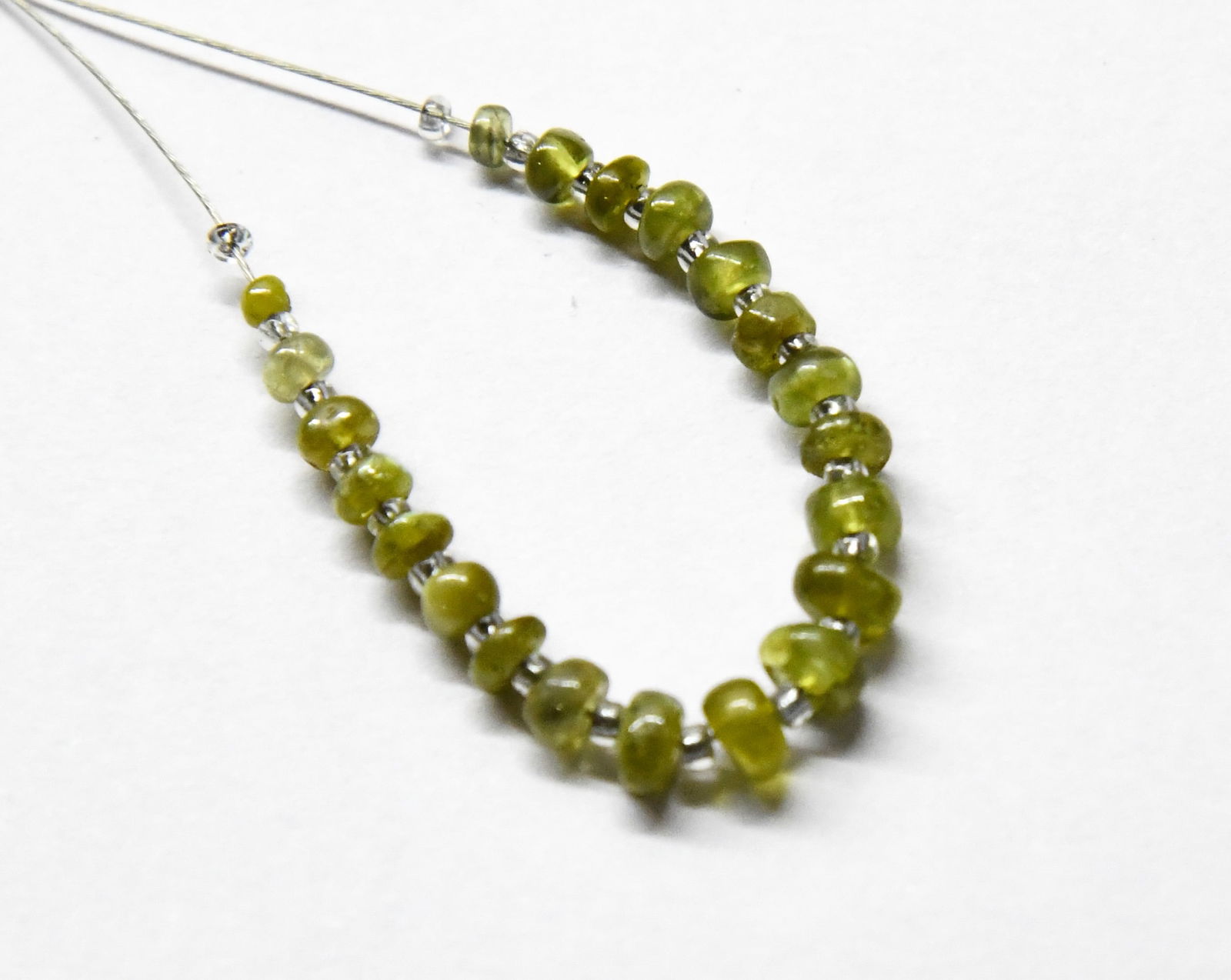 NATURAL CHRYSOBERYL BEADS RONDELLE 2 - 4 MM, 21 PCS: These are natural, earth mined and hand crafted with precision. Stone: Chrysoberyl, Stone Shape: Rondelle, Stone Size: 2 - 4 mm, Width: 1.5 - 2.5 mm, Weight: approx. 6 carats. The photographs are gene