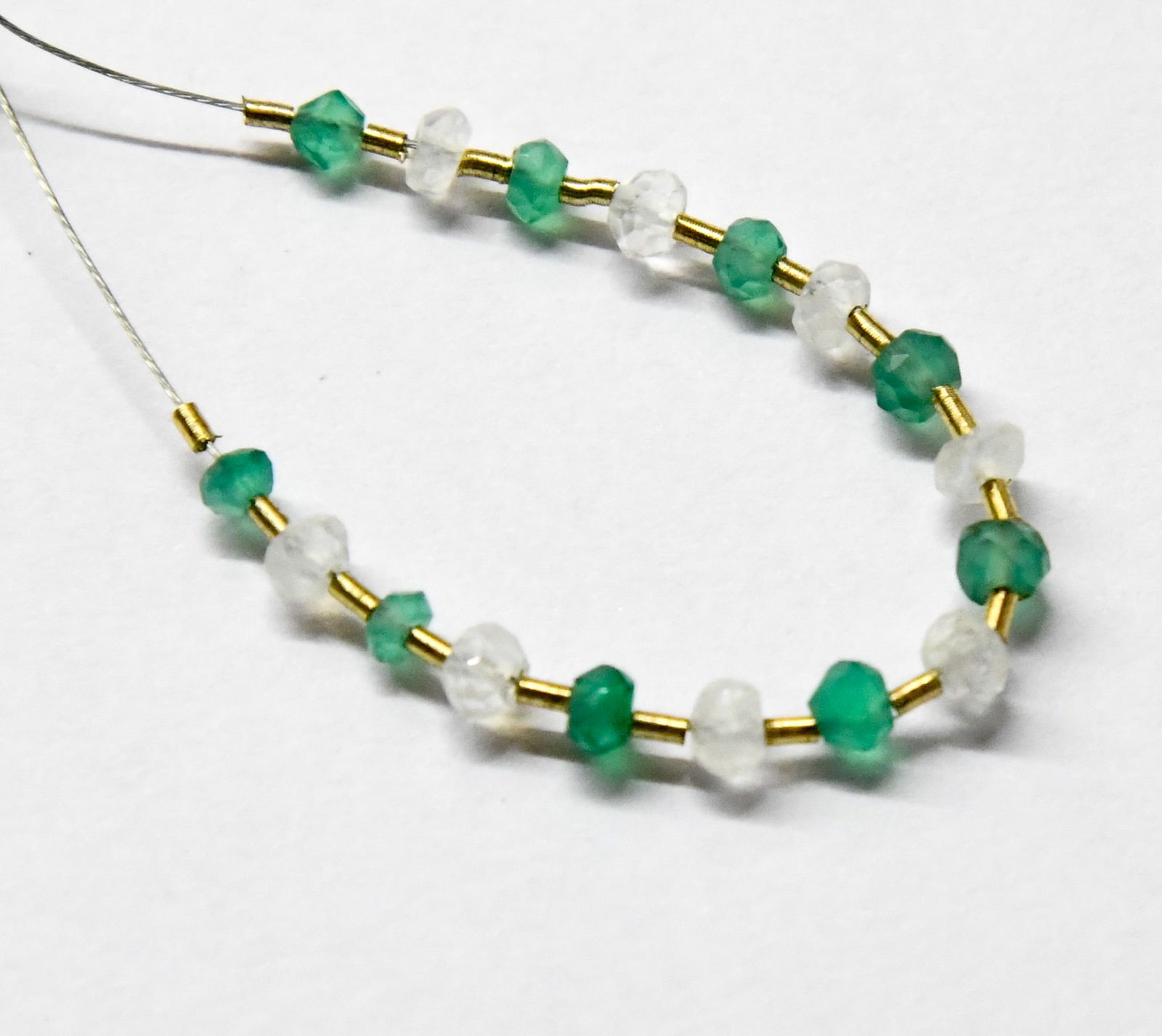 NATURAL MOONSTONE/GREEN ONYX BEADS FACETED RONDELLE 3 - 3.5 MM, 17 PCS: These are natural, earth mined and hand crafted with precision. Stone: Moonstone/Green Onyx, Stone Shape: Faceted Rondelle, Stone Size: 3 - 3.5 mm, Width: 2 - 3 mm, Weight: approx. 3.50 carats. The ph