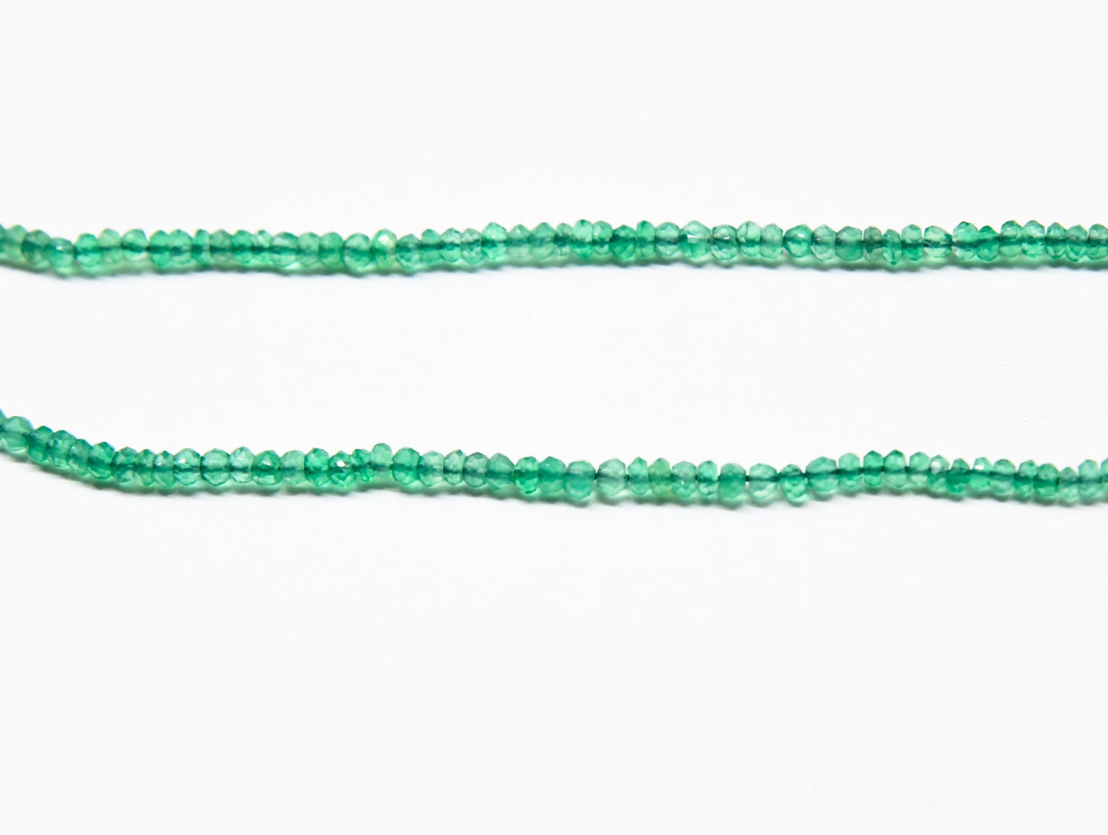 NATURAL GREEN ONYX BEADS FACETED RONDELLE 3 - 3.5 MM, 12.5" STRAND: These are natural, earth mined and hand crafted with precision. Stone: Green Onyx, Stone Shape: Faceted Rondelle, Stone Size: 3 - 3.5 mm, Width: 1.5 - 2 mm, Weight: approx. 29.11 carats. The photograp