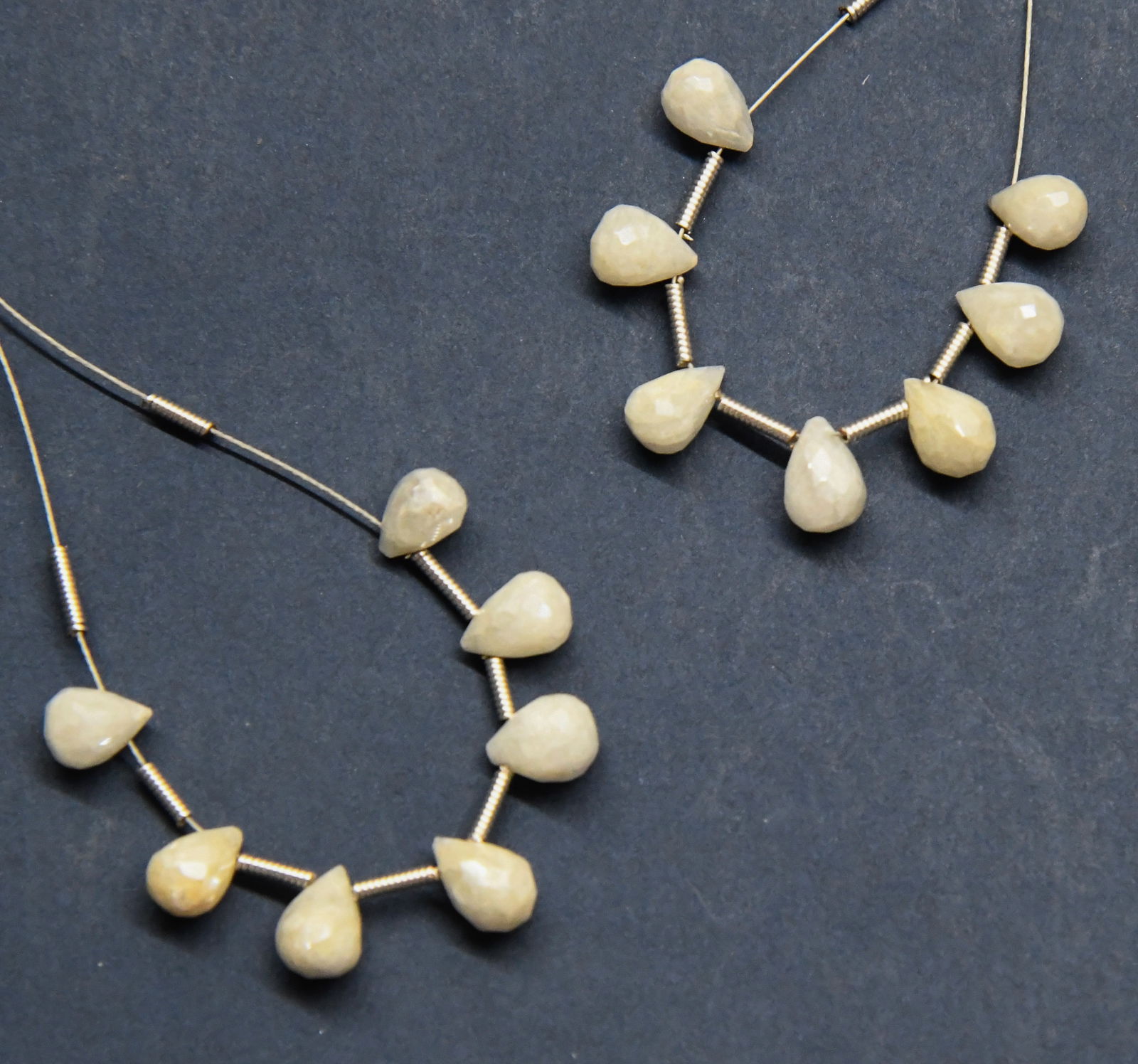 NATURAL SILLIMANITE BEADS FACETED BRIOLETTE 4X6 - 5X7 MM, 7 PCS (2 TASSELS): These are natural, earth mined and hand crafted with precision. Stone: Sillimanite, Stone Shape: Faceted Briolette, Stone Size: 4x6 - 5x7 mm, Weight: approx. 8.5 carats. The photographs are generally