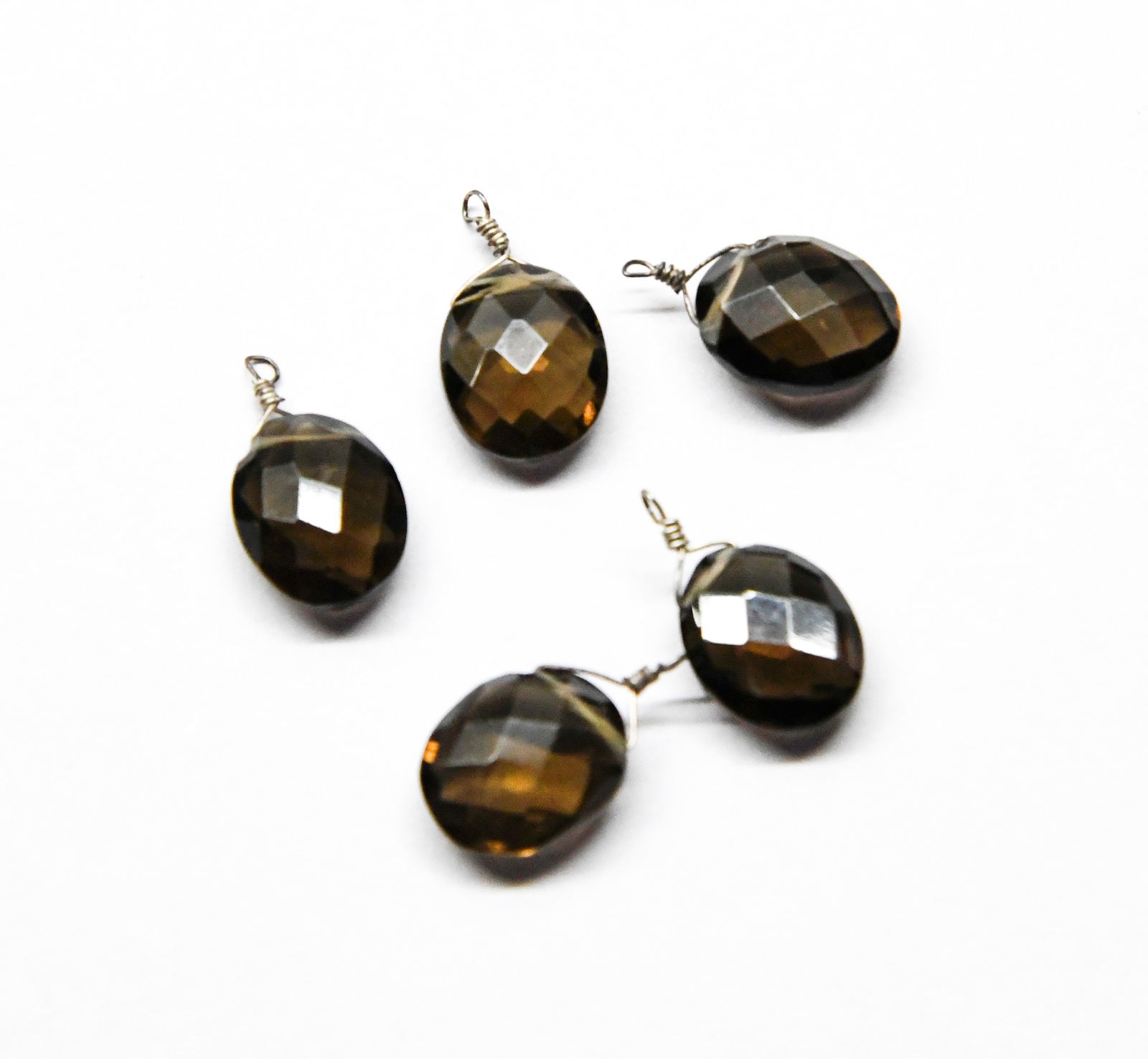 NATURAL SMOKY QUARTZ BEADS FACETED OVAL 10X12 MM 5 PCS: These are natural, earth mined and hand crafted with precision. Stone: Smoky Quartz, Stone Shape: Faceted Oval, Stone Size: 10x12 mm, Width: 5 - 5.5 mm, Weight: approx. 20.60 carats. The photographs a