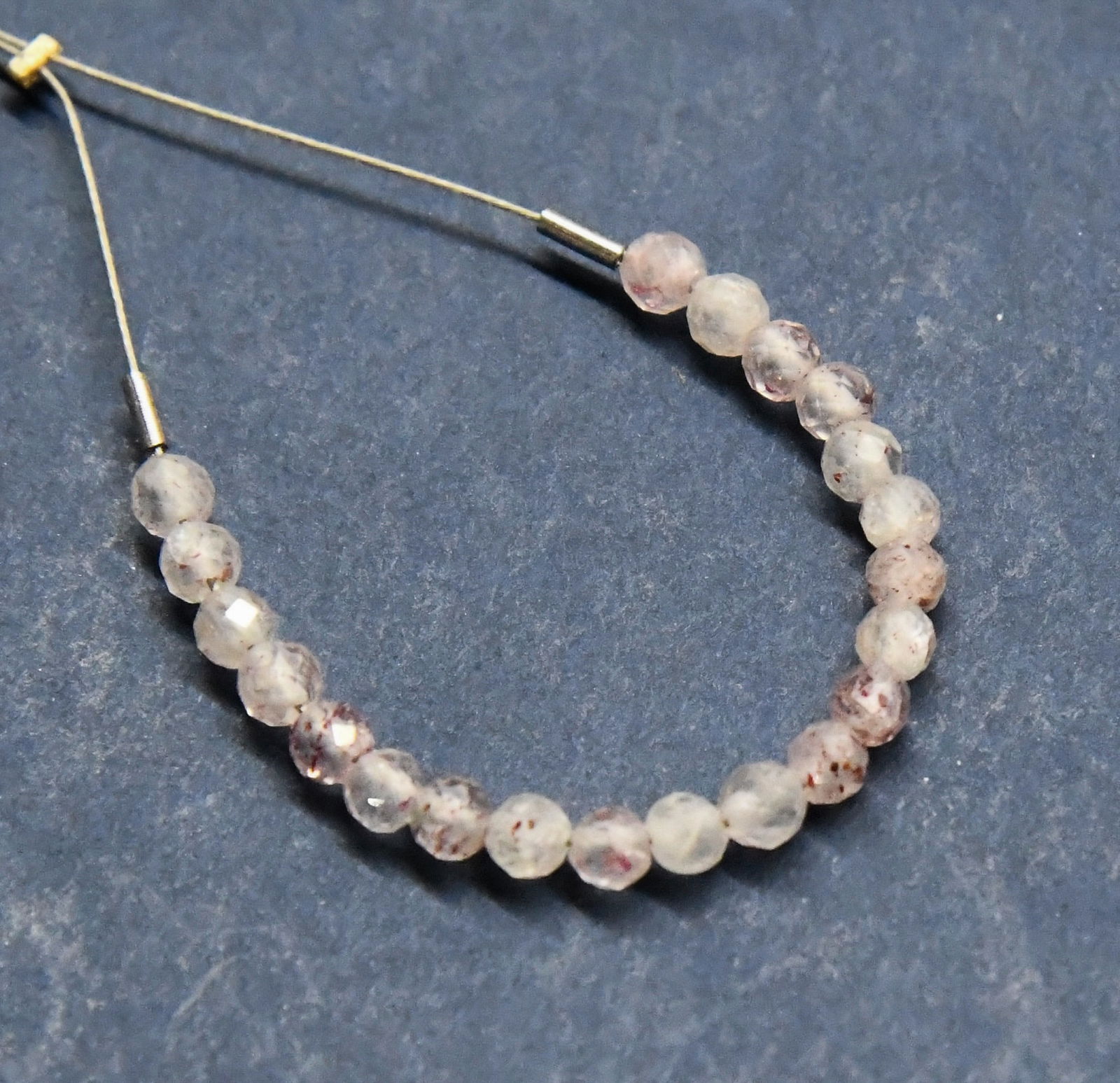 STRAWBERRY QUARTZ BEADS FACETED ROUND 3 MM 21 PCS: These are natural, earth mined and hand crafted with precision. Stone: Strawberry Quartz, Stone Shape: Faceted Round, Stone Size: 3 mm, Weight: approx. 3.5 carats. The photographs are generally enlarg