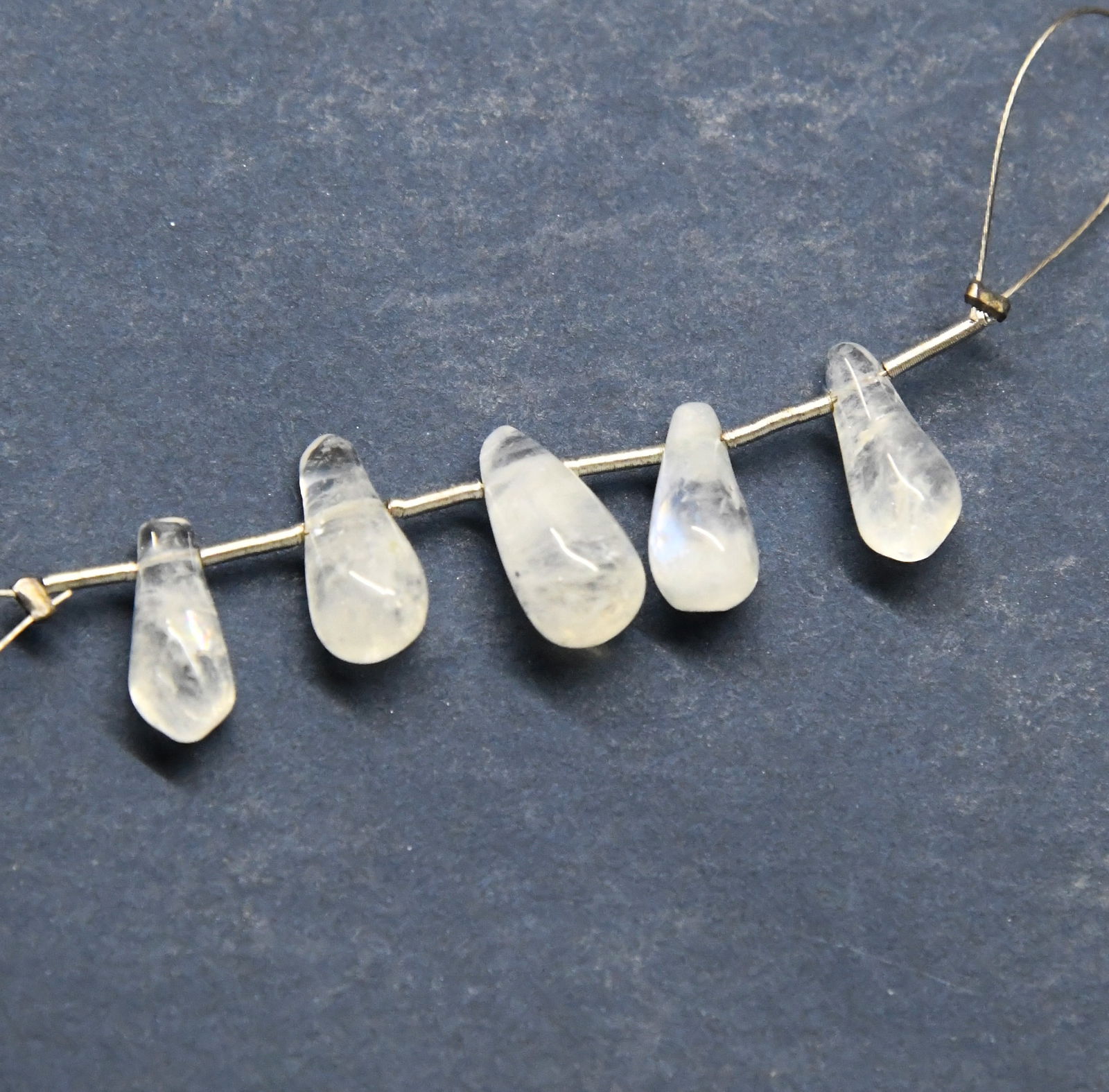 NATURAL RAINBOW MOONSTONE BEADS BRIOLETTE 4.5X12 - 6X12.5 MM 5 PCS: These are natural, earth mined and hand crafted with precision. Stone: Rainbow Moonstone, Stone Shape: Briolette, Stone Size: 4.5x12 - 6x12.5 mm, Weight: approx. 12.5 carats. The photographs are gener