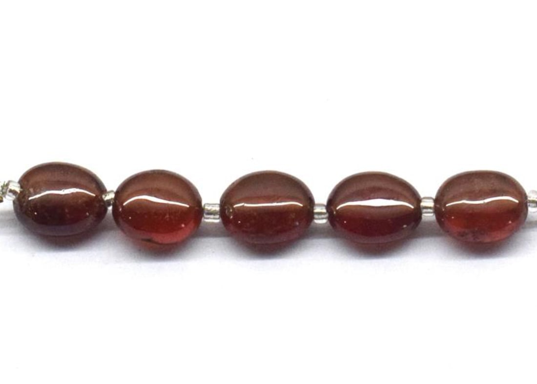 NATURAL HESSONITE GARNET BEADS OVAL 6.5X7.5 - 7X8.5 MM 5 PCS: These are natural, earth mined and hand crafted with precision. Stone: Hessonite Garnet, Stone Shape: Oval, Stone Size: 6.5x7.5 - 7x8.5 mm, Width: 3.5 - 5 mm, Weight: approx. 12.5 carats. The photogra