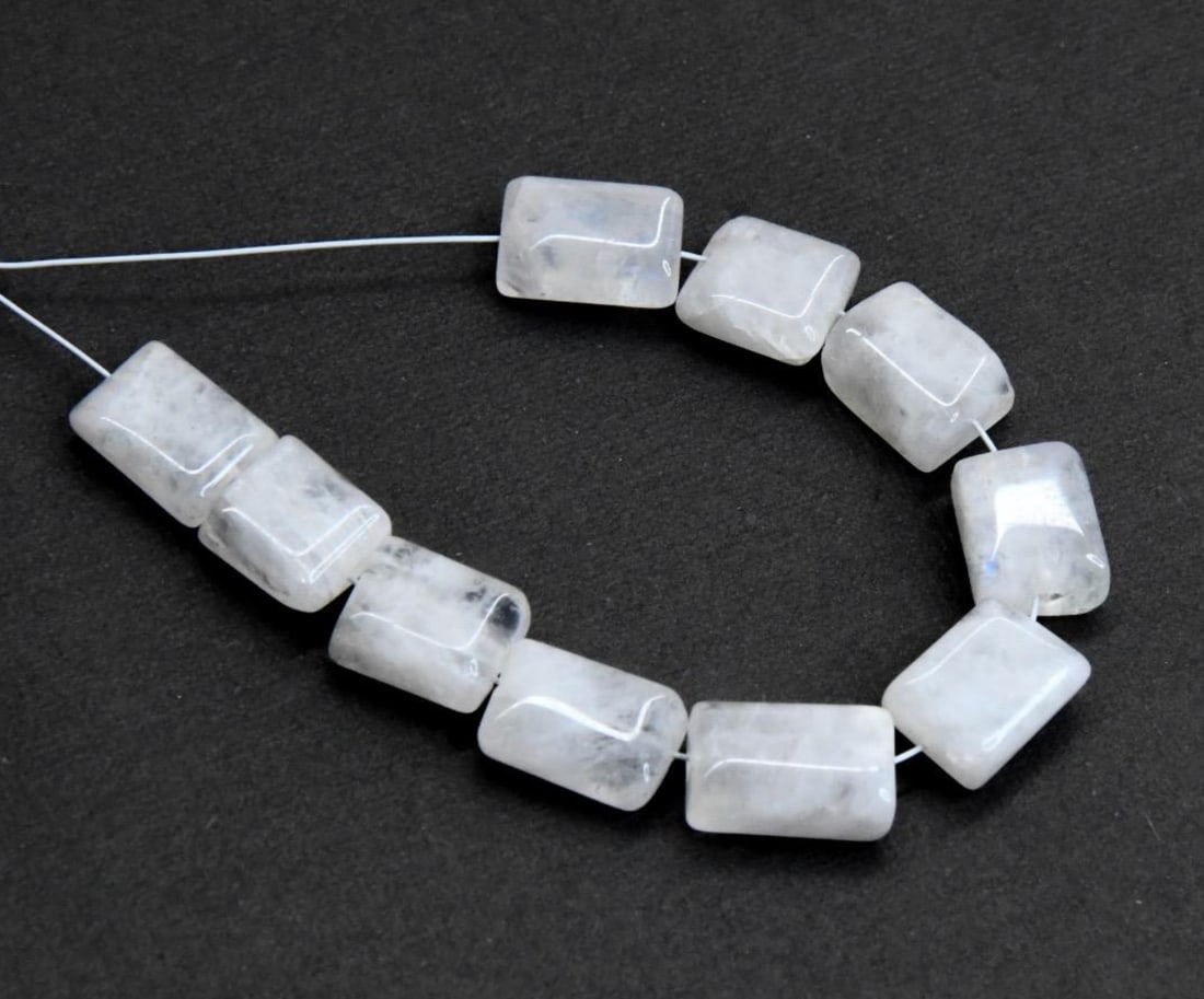 NATURAL RAINBOW MOONSTONE BEADS CHICKLET 10 PCS, 6.5X8 - 6.5X10 MM (2 TASSELS): These are natural, earth mined and hand crafted with precision. Stone: Rainbow Moonstone, Stone Shape: Chicklet, Stone Size: 6.5x8 - 6.5x10 mm, Width: 3 - 4.5 mm, Weight: approx. 27 carats. The photog