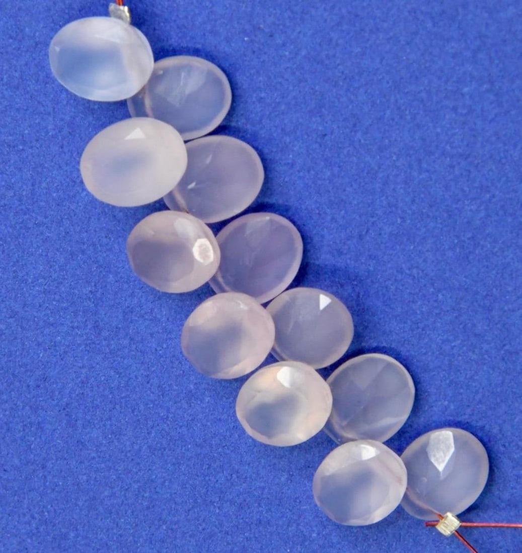 NATURAL PINK CHALCEDONY BEADS FACETED OVAL 8X10 MM 12 PCS: These are natural, earth mined and hand crafted with precision. Stone: Pink Chalcedony, Stone Shape: Faceted Oval, Stone Size: 8x10 mm, Width: 4 - 6 mm, Weight: approx. 28 carats. The photographs are