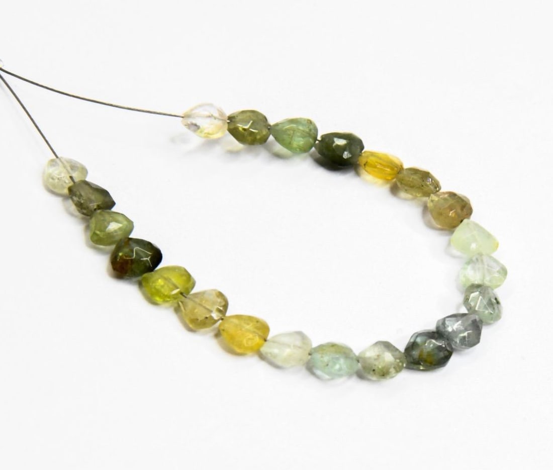 NATURAL MULTI TOURMALINE BEADS FACETED HEART 4.5 - 5 MM 22 PCS: These are natural, earth mined and hand crafted with precision. Stone: Multi Tourmaline, Stone Shape: Faceted Heart, Stone Size: 4.5 - 5 mm, Width: 2 - 3 mm, Weight: approx. 10 carats. The photographs