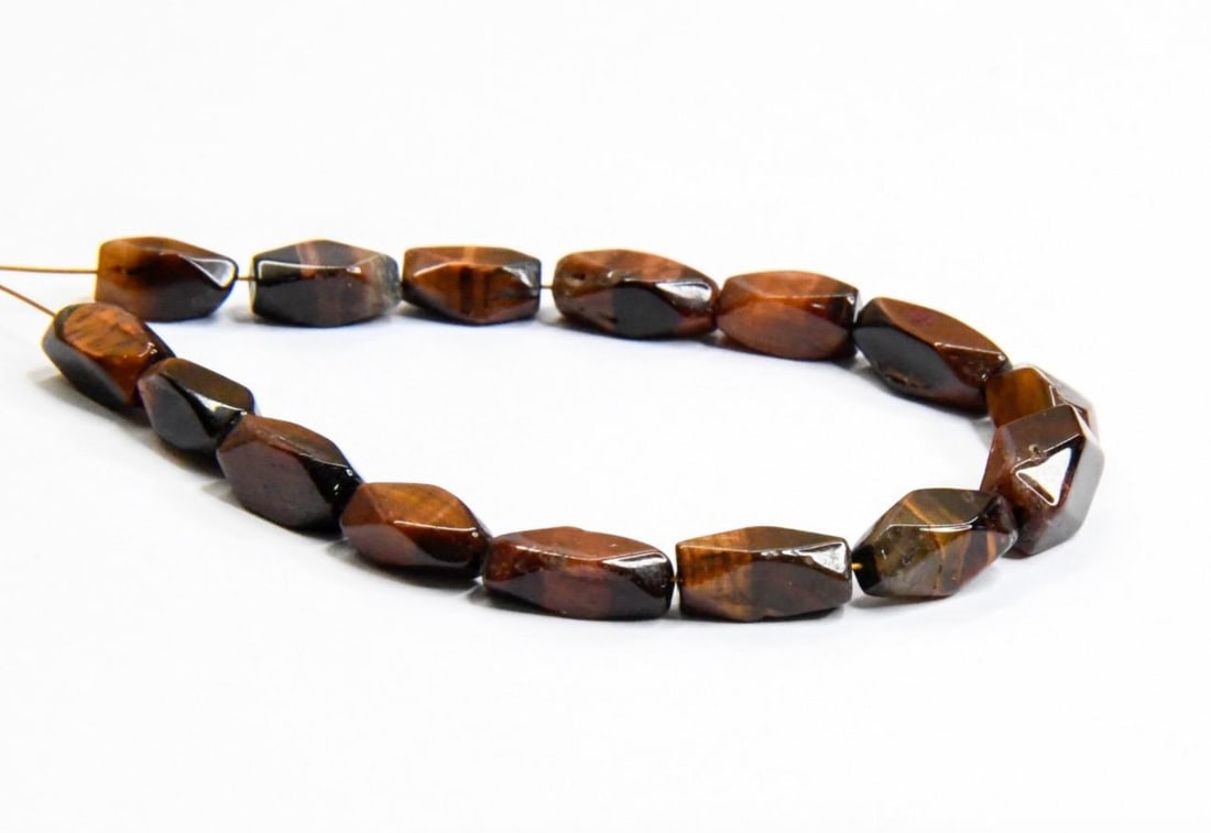 NATURAL TIGER'S EYE BEADS FACETED CUBE 3.5X8 - 5X9 MM 15 PCS: These are natural, earth mined and hand crafted with precision. Stone: Red Tiger's Eye, Stone Shape: Faceted Cube, Stone Size: 3.5x8 - 5x9 mm, Weight: approx. 22 carats. The photographs are generally