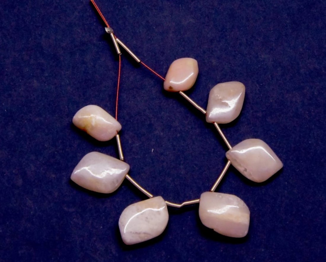 NATURAL PINK OPAL BEADS FANCY 7X11 - 10X15 MM, 7 PCS: These are natural, earth mined and hand crafted with precision. Stone: Pink Opal, Stone Shape: Fancy, Stone Size: 7x11 - 10x15 mm, Width: 3 - 4.5 mm, Weight: approx. 23 carats. The photographs are gen