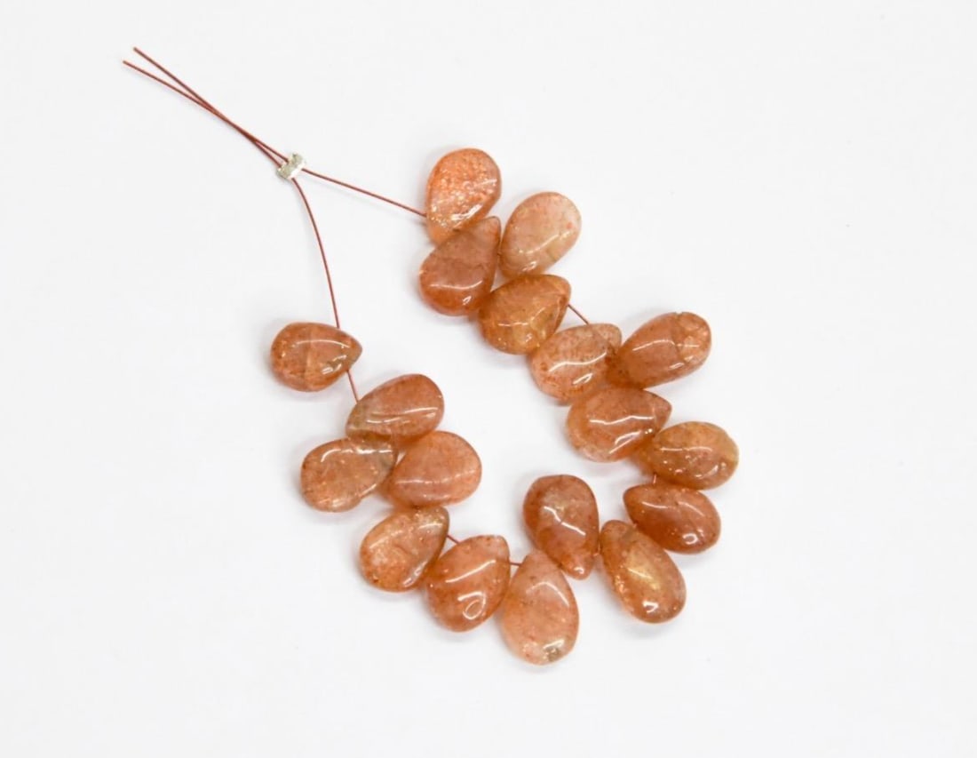 NATURAL SUNSTONE BEADS PEAR 6X8.5 - 6.5X10 MM, 18 PCS: These are natural, earth mined and hand crafted with precision. Stone: Sunstone, Stone Shape: Pear, Stone Size: 6x8.5 - 6.5x10 mm, Width: 3 - 4 mm, Weight: approx. 31 carats. The photographs are gener