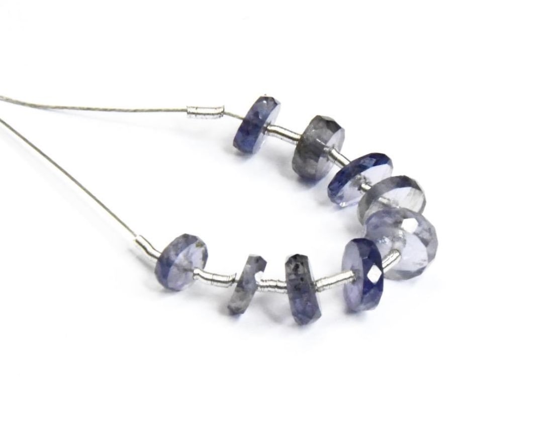NATURAL IOLITE BEADS FACETED TYRE 5 - 6.5 MM, 9 PCS: These are natural, earth mined and hand crafted with precision. Stone: Iolite, Stone Shape: Faceted Tyre, Stone Size: 5 - 6.5 mm, Width: 1.5 - 2 mm, Weight: approx. 5 carats. The photographs are gener