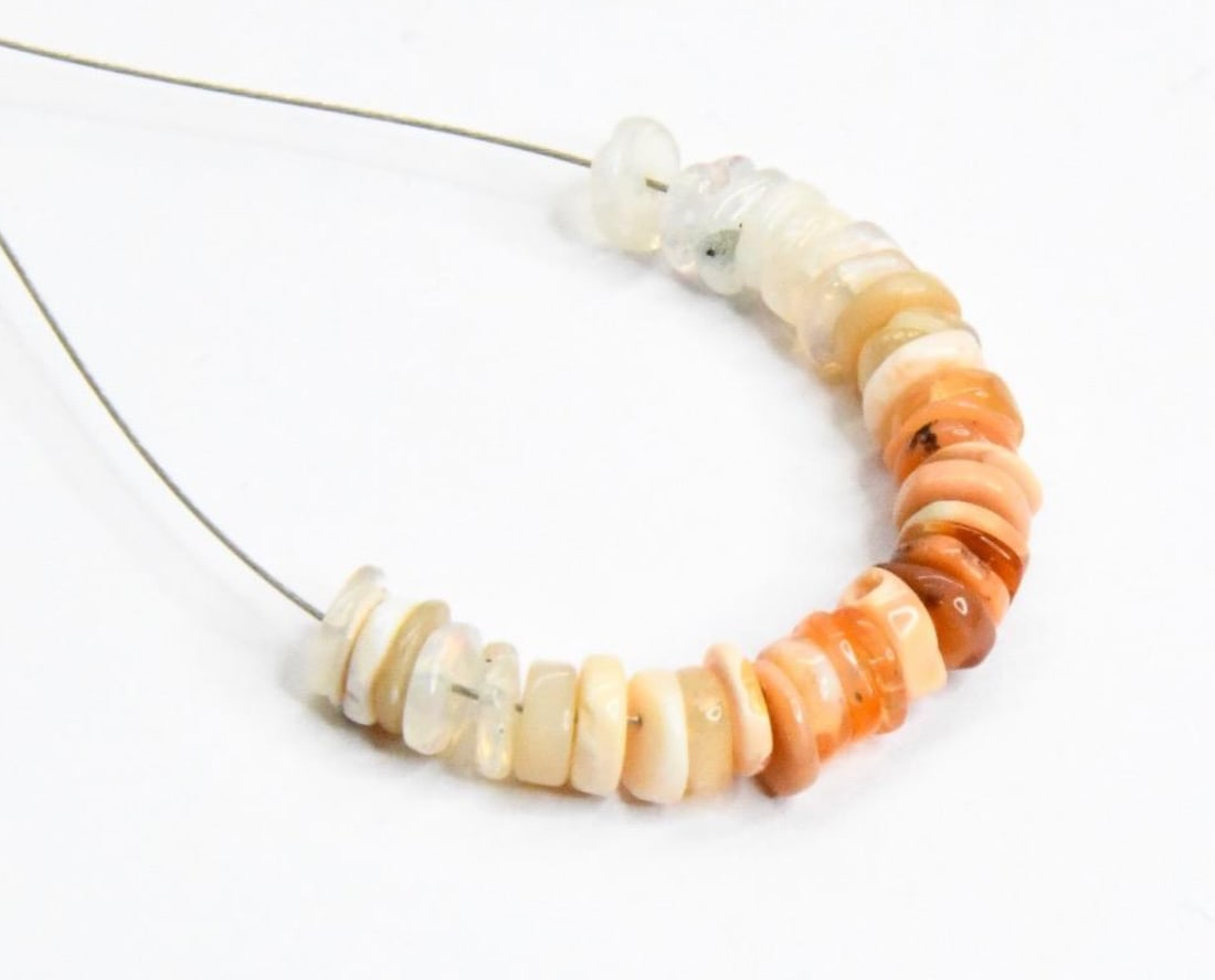 NATURAL FIRE OPAL BEADS TYRE 4.5 MM, 35 PCS: These are natural, earth mined and hand crafted with precision. Stone: Fire Opal, Stone Shape: Tyre, Stone Size: 4.5 mm, Width: 1 - 2 mm, Weight: approx. 6 carats. The photographs are generally enlarg