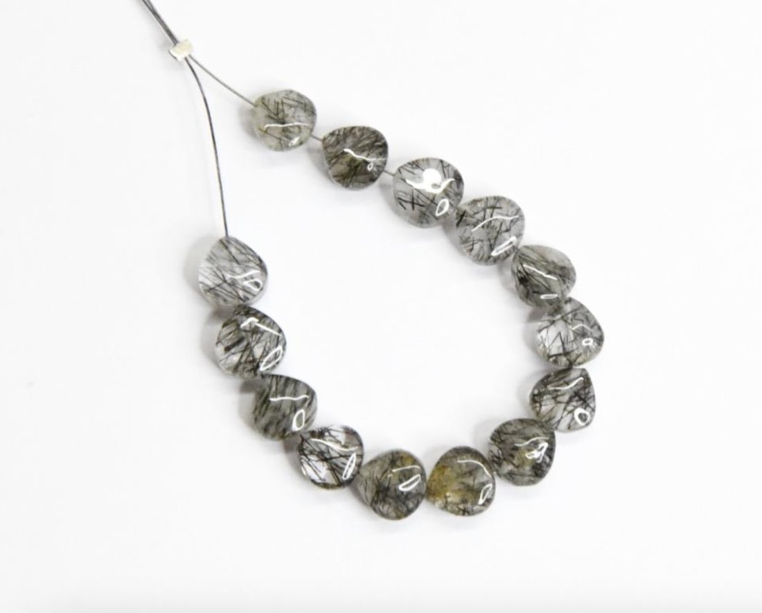 NATURAL BLACK RUTILE BEADS HEART 7 MM, 14 PCS: These are natural, earth mined and hand crafted with precision. Stone: Black Rutile, Stone Shape: Heart, Stone Size: 7 mm, Width: 3 - 4.5 mm, Weight: approx. 20 carats. The photographs are generally e