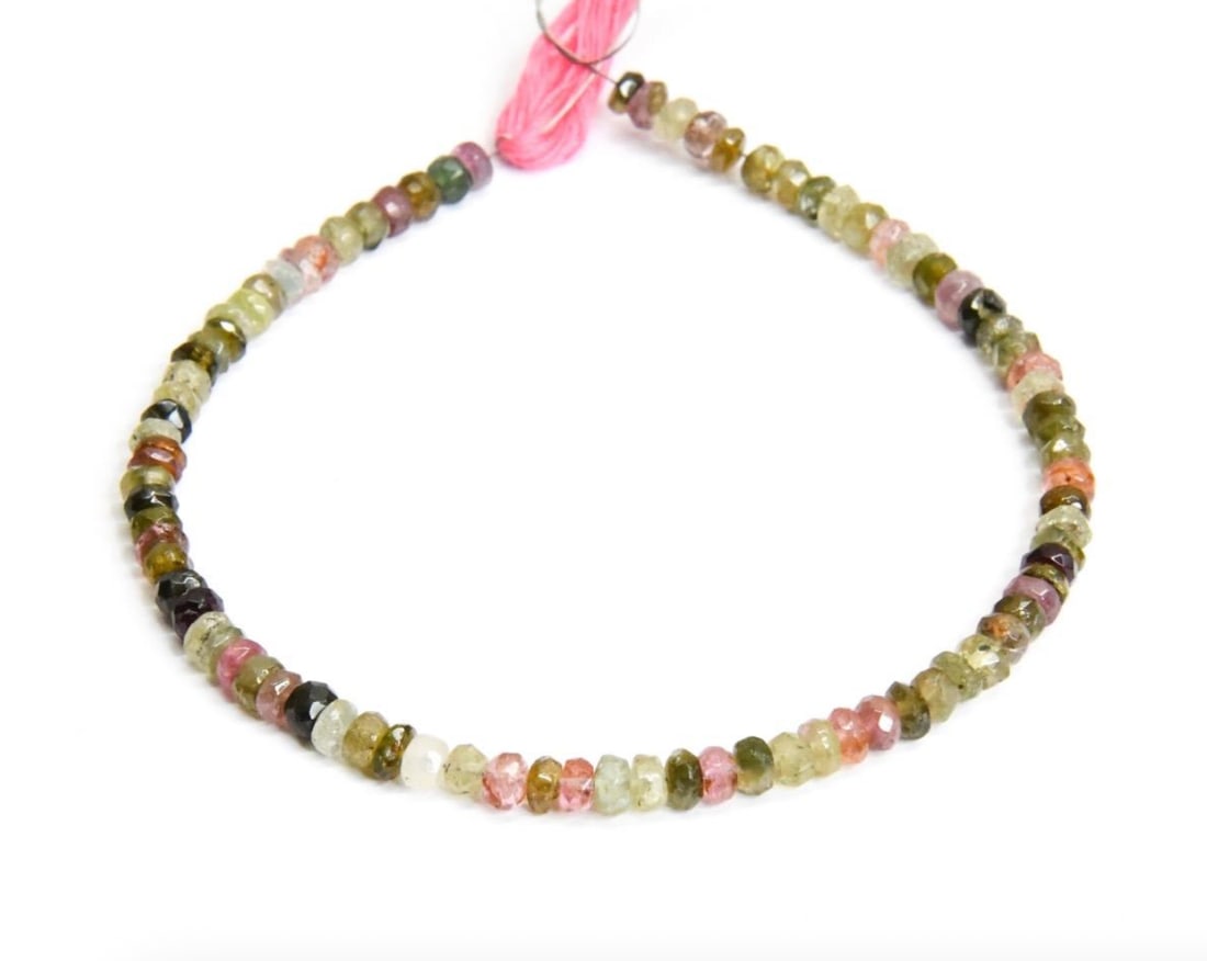 NATURAL MULTI TOURMALINE BEADS FACETED RONDELLE 4 MM, 8" STRAND: These are natural, earth mined and hand crafted with precision. Stone: Multi Tourmaline, Stone Shape: Faceted Rondelle, Stone Size: 4 mm, Width: 1.5 - 3 mm, Weight: approx. 30 carats. The photographs