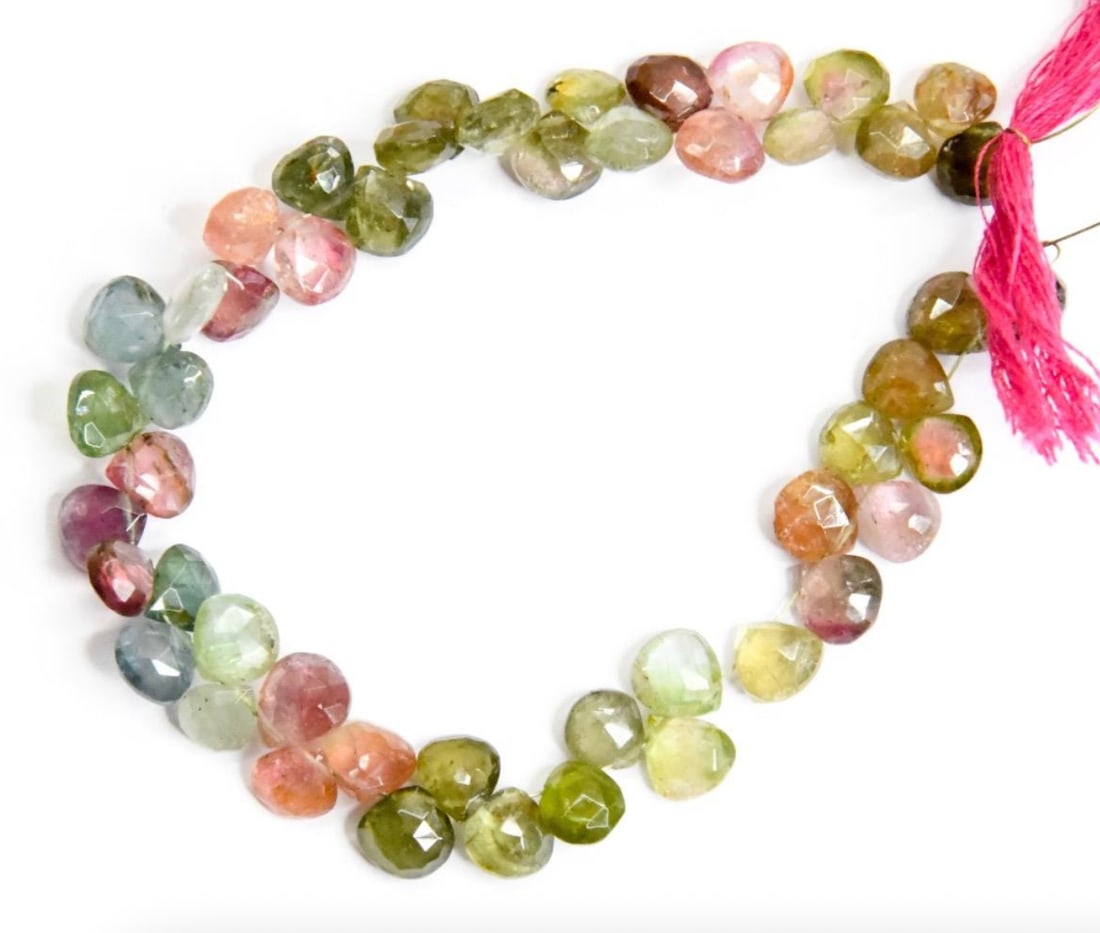 NATURAL MULTI TOURMALINE BEADS FACETED HEART 6x6.5 - 6.5x7 MM, 6" STRAND: These are natural, earth mined and hand crafted with precision. Stone: Multi Tourmaline, Stone Shape: Faceted Heart, Stone Size: 6x6.5 - 6.5x7 mm, Width: 2.5 - 4 mm, Weight: approx. 57 carats. The pho
