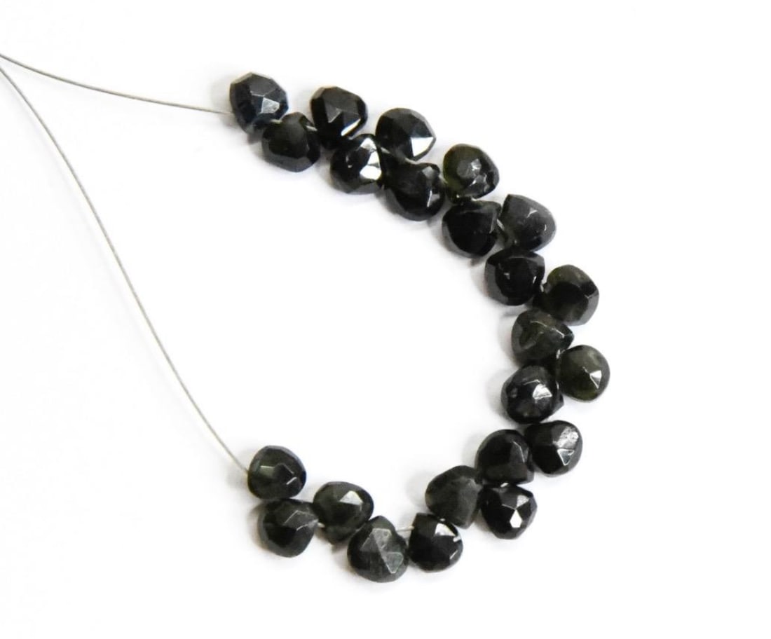 NATURAL BLACK TOURMALINE BEADS FACETED HEART 4.5 - 5 MM, 23 PCS: These are natural, earth mined and hand crafted with precision. Stone: Black Tourmaline, Stone Shape: Faceted Heart, Stone Size: 4.5 - 5 mm, Width: 2.5 - 3 mm, Weight: approx. 10 carats. The photograp