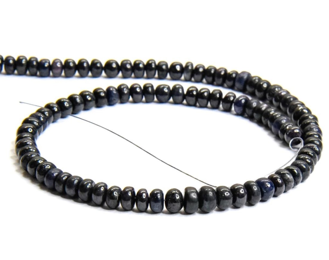 NATURAL BLUE SAPPHIRE (DYED) BEADS RONDELLE 5 - 6 MM, 12" STRAND: These are natural, earth mined and hand crafted with precision. Stone: Blue Sapphire (Dyed), Stone Shape: Rondelle, Stone Size: 5 - 6 mm, Width: 3 - 3.5 mm, Weight: approx. 98 carats. The photographs