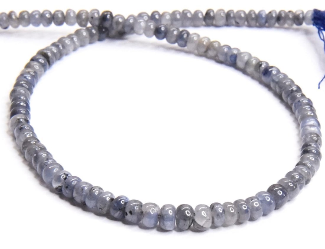 NATURAL TANZANITE BEADS RONDELLE 3.5 - 5 MM, 10.5" STRAND: These are natural, earth mined and hand crafted with precision. Stone: Tanzanite, Stone Shape: Rondelle, Stone Size: 3.5 - 5 mm, Width: 2 - 3 mm, Weight: approx. 56 carats. The photographs are general