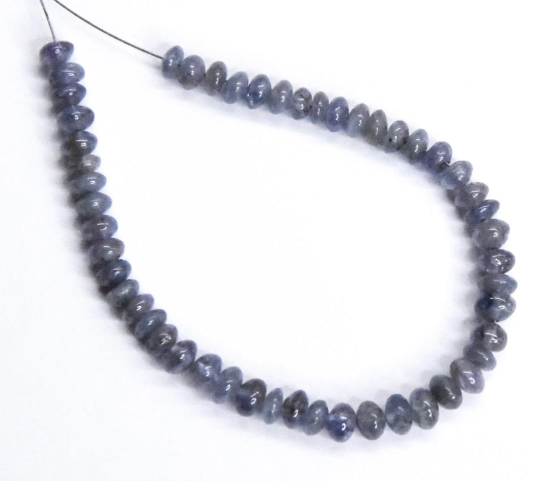 NATURAL TANZANITE BEADS RONDELLE 4.5 - 5 MM, 51 PCS: These are natural, earth mined and hand crafted with precision. Stone: Tanzanite, Stone Shape: Rondelle, Stone Size: 4.5 - 5 mm, Width: 2 - 3.5 mm, Weight: approx. 31 carats. The photographs are gener