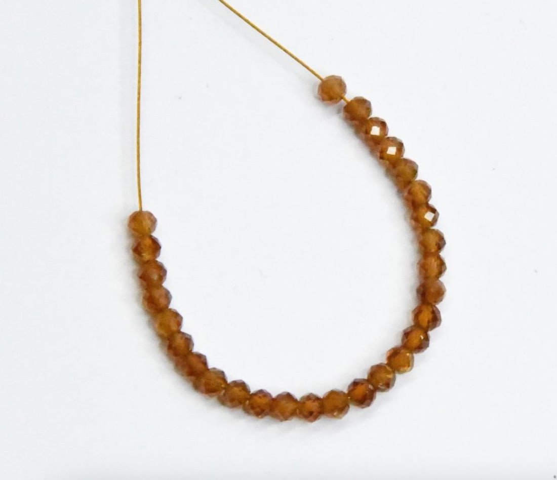 NATURAL HESSONITE GARNET BEADS FACETED ROUND 3 MM, 28 PCS: These are natural, earth mined and hand crafted with precision. Stone: Hessonite Garnet, Stone Shape: Faceted Round, Stone Size: 3 mm, Weight: approx. 5.50 carats. The photographs are generally enlarg