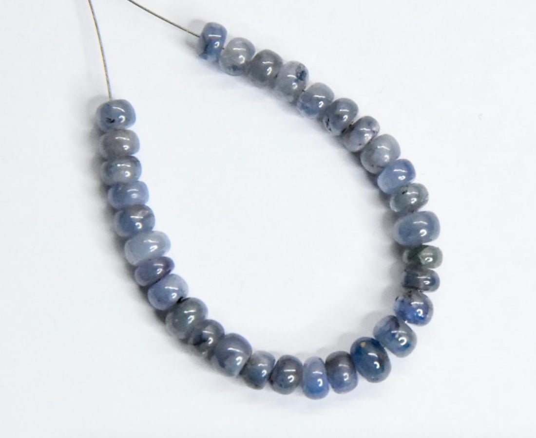 NATURAL TANZANITE BEADS RONDELLE 4.5 - 5 MM, 31 PCS: These are natural, earth mined and hand crafted with precision. Stone: Tanzanite, Stone Shape: Rondelle, Stone Size: 4.5 - 5 mm, Width: 2 - 3.5 mm, Weight: approx. 27 carats. The photographs are gener