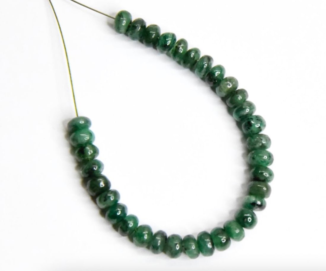 NATURAL EMERALD BEADS RONDELLE 4.5 - 5 MM, 33 PCS: These are natural, earth mined and hand crafted with precision. Stone: Emerald, Stone Shape: Rondelle, Stone Size: 4.5 - 5 mm, Width: 2 - 3 mm, Weight: approx. 14 carats. The photographs are generally
