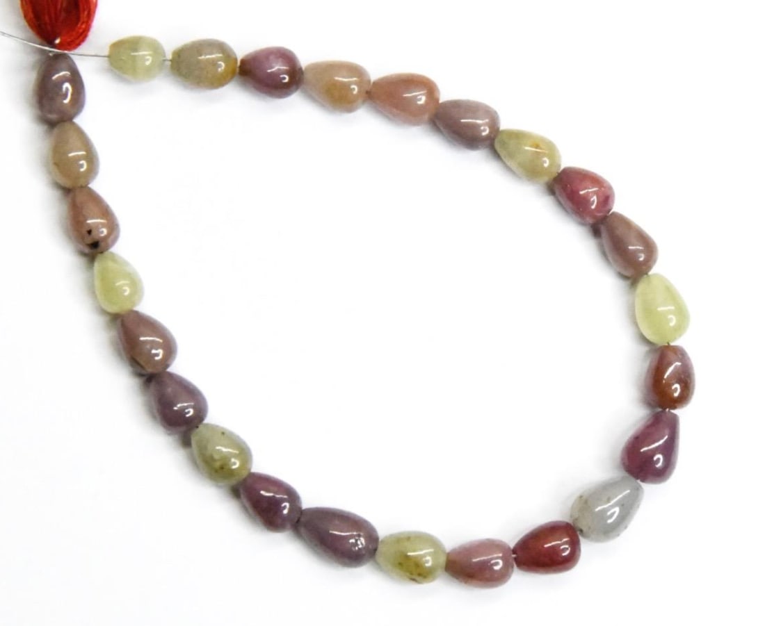 NATURAL MULTI SAPPHIRE BEADS TOPDRILL DROPS 4X5 - 5X7 MM, 6.5" STRAND: These are natural, earth mined and hand crafted with precision. Stone: Multi Sapphire, Stone Shape: Topdrill Drops, Stone Size: 4.5x5.5 - 5x7.5 mm, Weight: approx. 43 carats. The photographs are gener