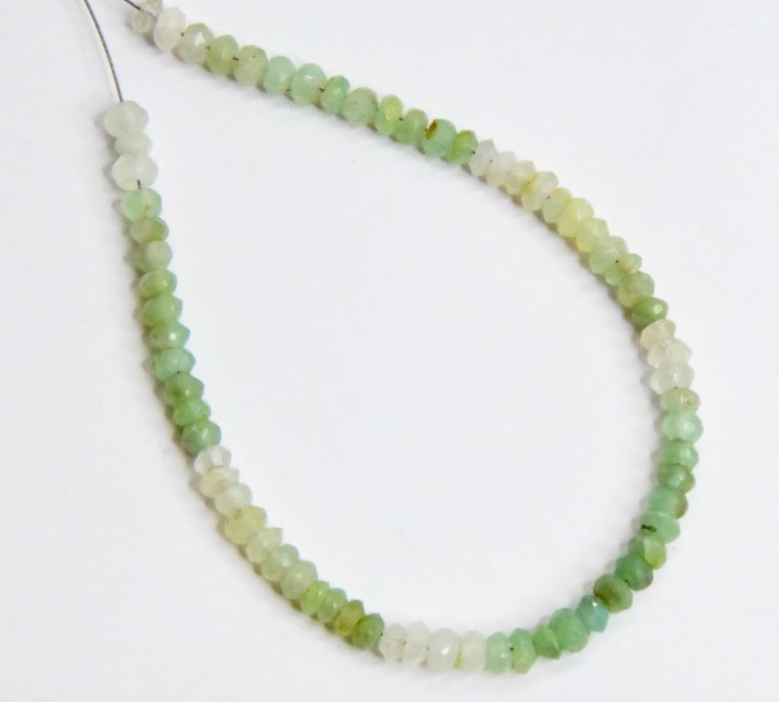 NATURAL PERUVIAN OPAL BEADS FACETED RONDELLE 3 - 3.5 MM, 69 PCS: These are natural, earth mined and hand crafted with precision. Stone: Peruvian Opal, Stone Shape: Faceted Rondelle, Stone Size: 3 - 3.5 mm, Width: 1.5 - 2.5 mm, Weight: approx. 14 carats. The photogr